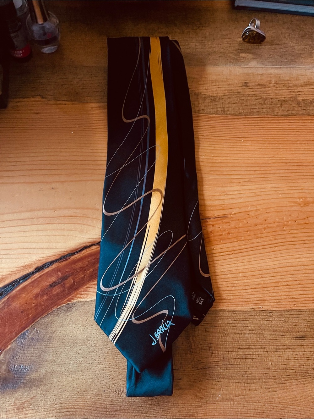 J. Garcia Black Tie with Gold Stripe and Silver Accents